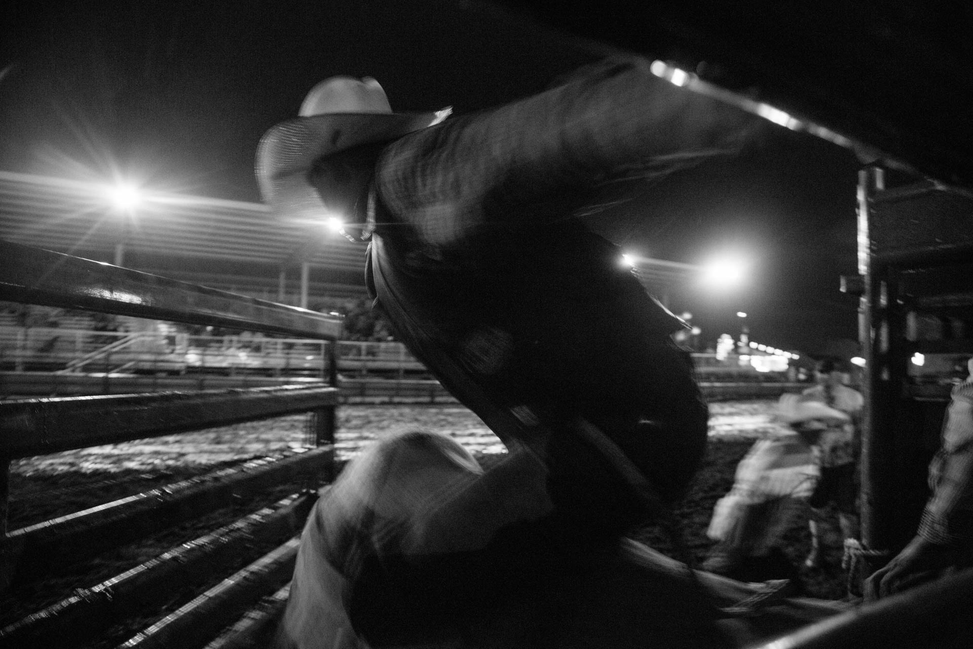 bull-rider-flies-out-of-chute-blur-a5377