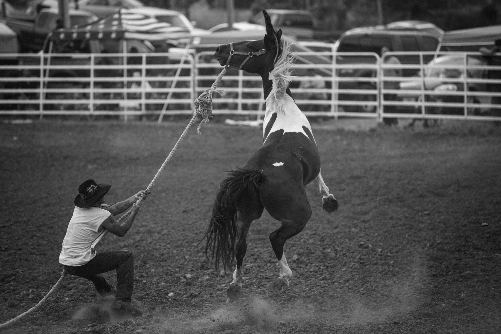 rosebud-wild-horse-race-cowboy-caught-jumping-horse-rodeo-travis-dewitz-3922.JPG